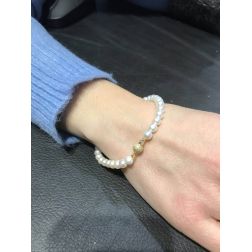 photo of worn Pearls Bracelet with yellow gold sandblasted sphere