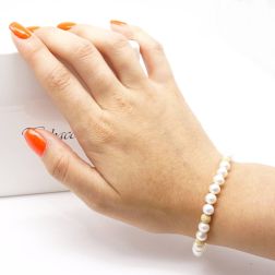 photo of worn Bracelet Pearls 2 x 2 yellow gold