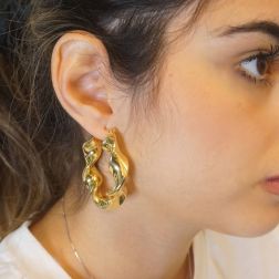 Photo of worn Oval torchon hoops earrings in yellow gold