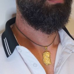 Photo of worn Head of Christ medal yellow gold and diamonds