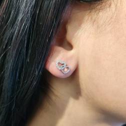 Photo of worn Double Heart shaped earrings 18kt white gold