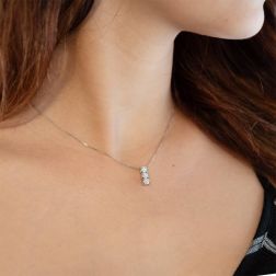 Photo of worn Trilogy Necklace 0.98ct with 3 GIA Certificate diamonds