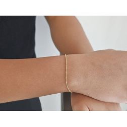 Bracciale palline oro giallo 19cm x 1,3mm chiusura moschettone foto indossata