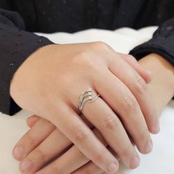 Photo of worn Trilogy ring in white gold and three-row Diamonds