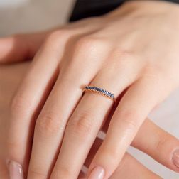 Photo of worn Veretta Ring 9 Blue Sapphires of 0.383ct in Rose Gold