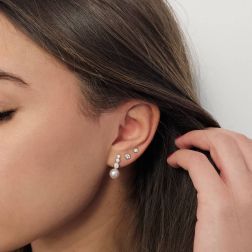 Photo of worn Scaled Circle Pearl and Diamond Earrings in White Gold