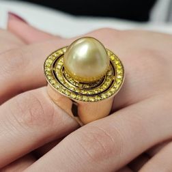 Photo of worn Ring with Gold pearl drop and Yellow Diamonds in a circle