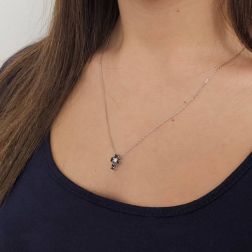 Photo of worn Necklace with Cross of Black Diamonds and 1 White - Width 8.3mm