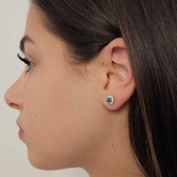 Photo of worn Point of Light Earrings with Emeralds and 28 Diamonds