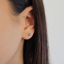 Photo of worn Classic Point of Light Earrings with Blue Diamonds 0,40ct