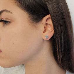 Photo of worn Point of Light Earrings with Aquamarine and 28 Diamonds