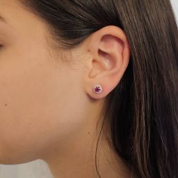 Photo of worn Point of Light Earrings with Rubies and 28 Diamonds