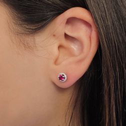 Photo of worn Point of Light Earrings with Rubies and 28 Diamonds