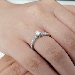 Photo of worn Solitaire "Bridge" 0.38ct GIA Diamond Platinum Signature Edge