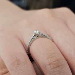 Photo of worn Solitaire "Bridge" 0.19ct GIA Diamond Platinum Signature Edge