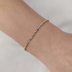 Photo of worn Baby Bracelet 3+1 spheres and perforated tube