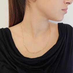 Photo of worn 50cm necklace Alternating width 2.70mm yellow gold