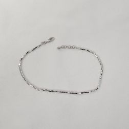 Bracelet/Anklet Octagonal faceted tubes in white gold.
