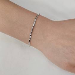 Bracciale/Cavigliera Tubetti ottagonali sfaccettati oro bianco. foto indossata
