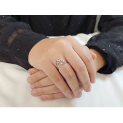 Photo of worn Trilogy in White Gold and Diamonds with three intertwined threads