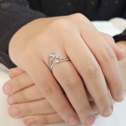 Photo of worn Trilogy in White Gold and Diamonds with three intertwined threads