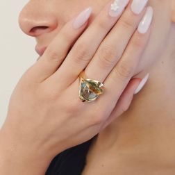 Photo of worn Design Ring "Mid-Summer Dream" with yellow and blue Topaz in 18kt yellow gold