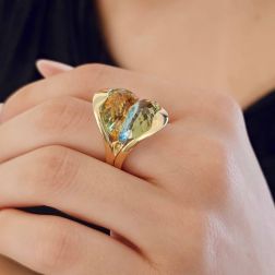 Photo of worn Design Ring "Mid-Summer Dream" with yellow and blue Topaz in 18kt yellow gold