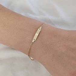 Photo of worn Baby Bracelet 1.60mm 3+1 Figaro chain with 3.90mm tag in Yellow Gold