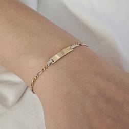 Photo of worn Bicolor Baby bracelet Figaro link with tag