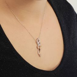 Photo of worn Hug “Pleasure” Pendant with Yellow Diamond