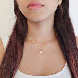 photo of worn Initial Letter "A" Pendant with Zircon in Yellow Gold