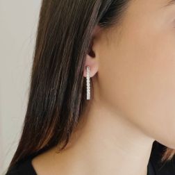 photo of worn of Hoop Earrings with a Half Round of Diamonds in Platinum