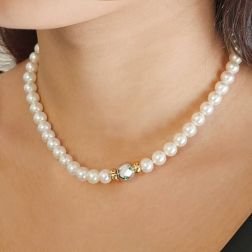 Photo of worn Akoya Pearl Necklace with Sphere Clasp and 9 Emeralds