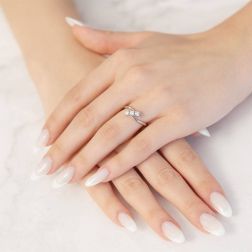 Photo of worn 0.34ct Oblique Trilogy Ring in Platinum