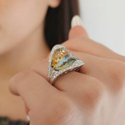 photo fo worn of Design Ring "Mid-Summer Dream" with yellow and blue Topaz and Diamonds in 18kt white gold