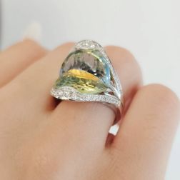 photo fo worn of Design Ring "Mid-Summer Dream" with yellow and blue Topaz and Diamonds in 18kt white gold