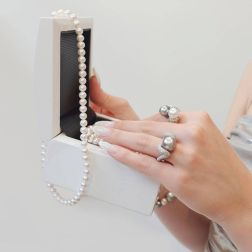 Photo of worn Wave Design Ring with Tahitian Pearl and Pavé Diamonds