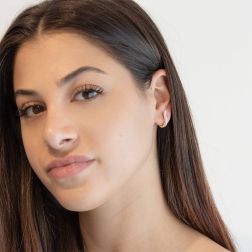 Photo of worn Yellow Gold Arch Shaped Lobe Hoops with Zircons