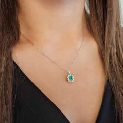 Photo of worn Kate Emerald Pendant, octagonal, 6x4mm, surrounded by 10 diamonds