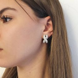 Photo of worn Infinito pavé earrings with 230 diamonds in white gold