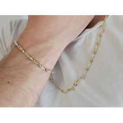 Photo of worn 60cm Tubular Partridge Eye necklace in alternate Yellow Gold with 2 beads in White