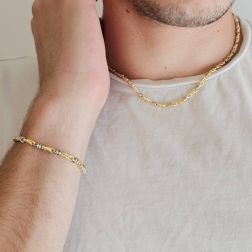 Photo of worn 45cm tubular necklace with round striped partridge eye in yellow gold alternating with 2 white eyelets