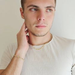 Bracciale Tubolare Occhio di pernice tonda rigata in Oro Giallo alternata con 2 occhielli in Bianco foto indossata