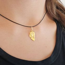 Photo of worn Holy Mary face pendant