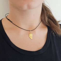 Photo of worn Holy Mary face pendant