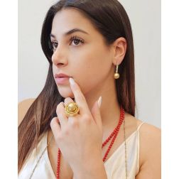 Photo of worn Ring with Gold pearl drop and Yellow Diamonds in a circle