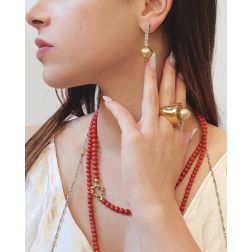 Photo of worn Coral flower clasp Necklace in Yellow Gold