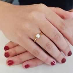 Photo of worn Oval Solitaire Ring with Round Zircon in yellow gold