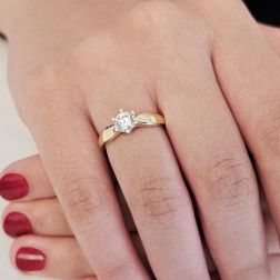 photo of worn Band Solitaire Ring with Round Zircon in Yellow Gold