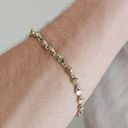 Photo of worn D&R bracelet in White and Yellow Gold